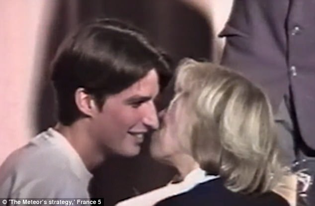 Footage captures the moment a 15-year-old Emmanuel Macron (left) kissed his 40-year-old teacher (right) - two years before he declared he wanted to marry her eiqeuiueitdglv